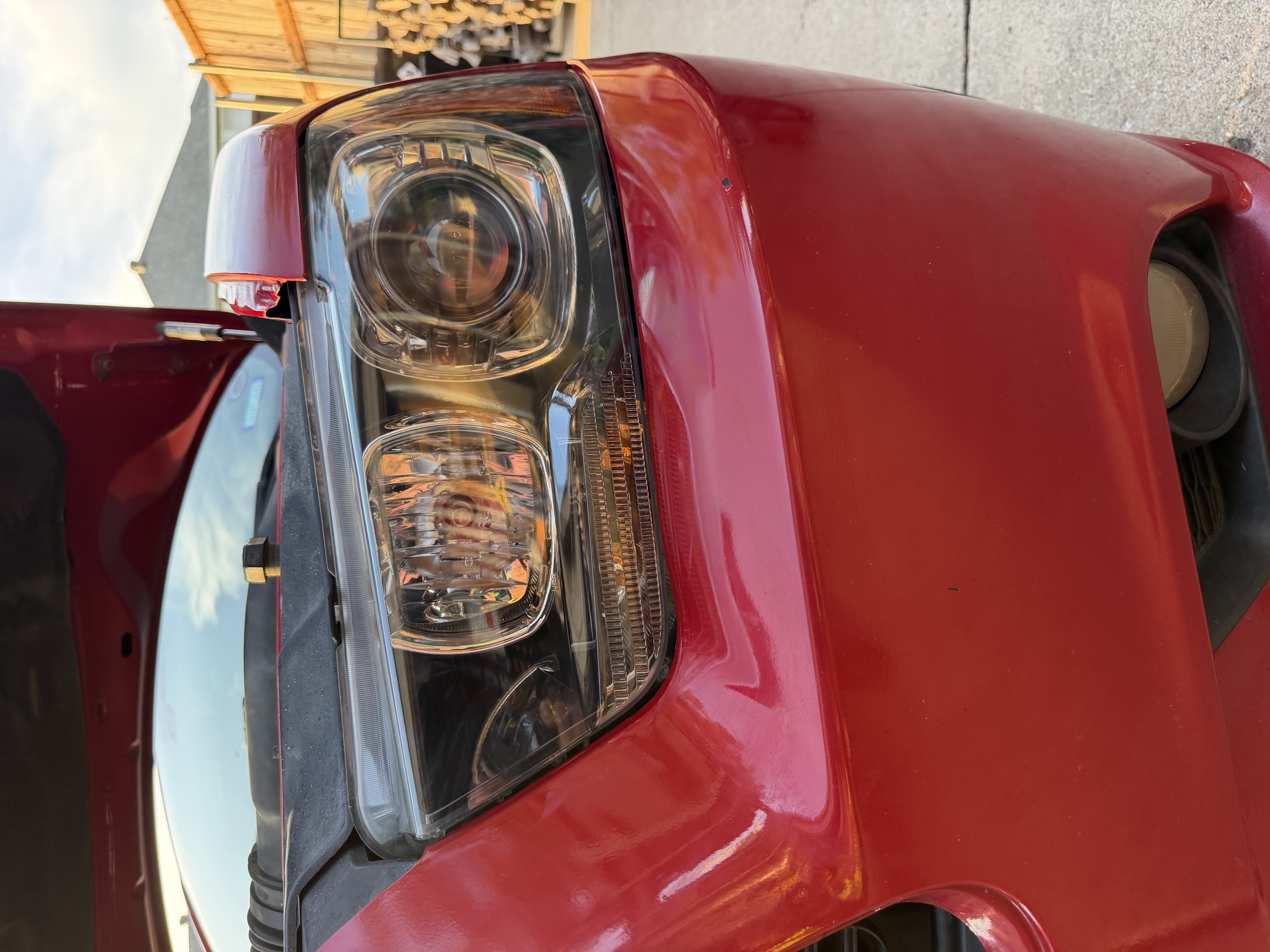 Clear Dodge Charger driver headlight after restoration